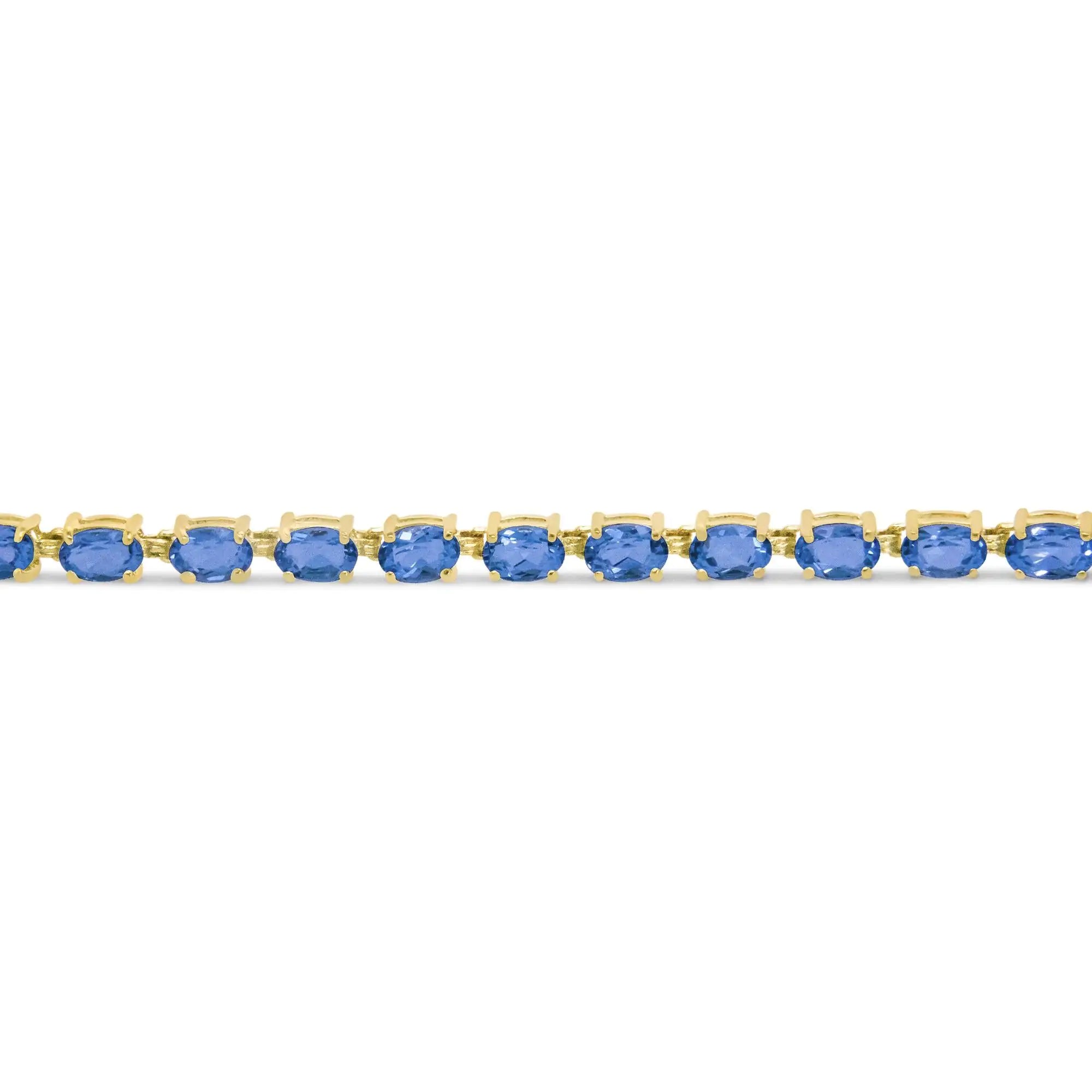 10K Yellow Gold and 4 Prong Set 6X4 MM Blue Topaz Link Tennis Bracelet - Size 7 Inches